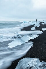 Wall Mural - Vertical shot of Iceland Diamond Beach. Jokulsarlon Glacier Lagoon Iceland