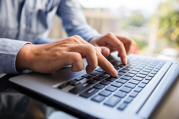 Wall Mural - Image of male hands typing on keyboard, selective focus.