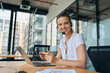 © Svitlana - Smiling female enjoying working in call centre with gadgets