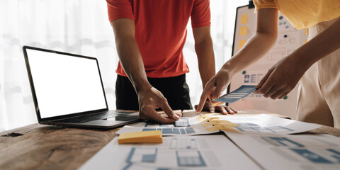 Graphic designers creative drawing website ux app development and application for mobile phone in the office.