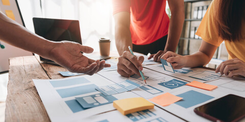 Graphic designers creative drawing website ux app development and application for mobile phone in the office.