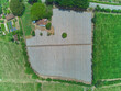aerial view of field with unseeded furrows
