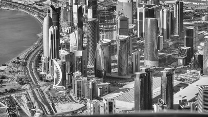 Poster - Doha, Qatar - December 12, 2016: Aerial view of city skyline from a flying airplane over the Qatar capital