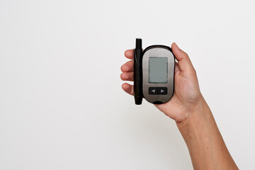 Wall Mural - someone holding their cell phone in one hand and pointing at it with the other hand, on a white back