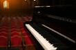 piano on stage in an empty concert hall view from the stage