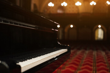 piano on stage in an empty concert hall view from the stage