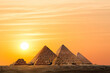 The Pyramids in Egypt sunset sky background with copy space