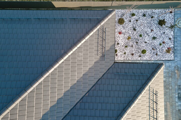 Wall Mural - Closeup of house roof top covered with ceramic shingles. Tiled covering of building