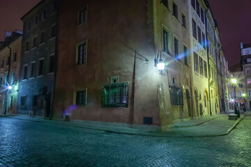 Wall Mural - Warsaw's Old Town illuminated street at night, Poland, Eastern europe