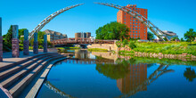 Big Sioux River Public Park Riverfront Trail Landscape With Water Reflections Of The Bridges In Downtown Sioux Falls, South Dakota, USA