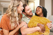 © Jade M/peopleimages.com - Family, love and hug, laughing and happiness with care and funny, bonding and couple with black child together at family home. Happy family, adoption or foster care and interracial with relationship.