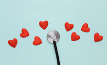 Stethoscope With Hearts On A Blue Background. Love Concept, Diagnosis Of Heart Disease