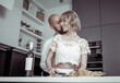 © splitov27 - Romantic, love concept. Young couple in love spend time together in the kitchen, preparing a romantic dinner. Handsome man and attractive young woman are happy together