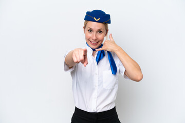 Wall Mural - Airplane blonde stewardess woman isolated on white background making phone gesture and pointing front