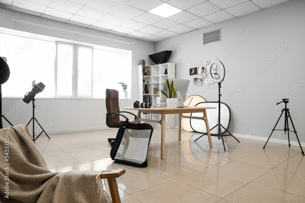 Photographer's workplace in interior of modern studio