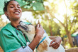 © S Fanti/peopleimages.com - Vet, happy and nurse with a dog in nature doing medical healthcare checkup and charity work for homeless animals. Smile, doctor or veterinarian loves nursing, working or helping dogs, puppy and pets