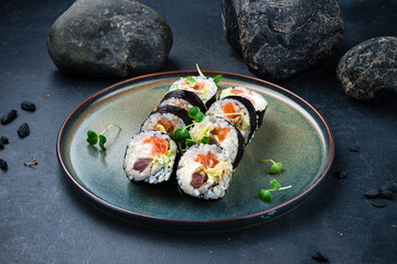 Sticker - Japanese sushi rolls set with tuna, salmon, Philadelphia cheese, avocado and microgreens.