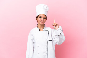 Canvas Print - Little caucasian chef girl isolated on pink background pointing with the index finger a great idea