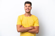 © luismolinero - Young caucasian man isolated on white background keeping the arms crossed in frontal position