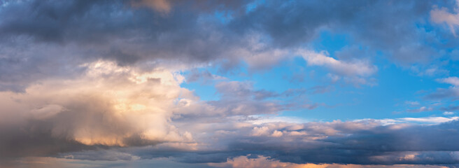 Wall Mural - Beautiful panoramic evening sky with dramatic clouds after thunderstorm