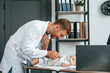 © standret - Using stethoscope. Doctor in white coat is taking care of little toddler indoors