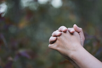 Christian life crisis prayer to god. Woman Pray for god blessing to wishing have a better life. woman hands praying to god with the bible. begging for forgiveness and believe in goodness.