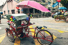 Traditional Mode Of Transportation For Tourists In Malaysia, Tricycle Parked On The Street In Penang, Malaysia