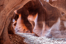 A Cave, Tunnel, Cavern With Curved Walls And Ceiling, Cut Through Red Sandstone Rock, Illuminated By Soft Light, Buckskin Gulch, Vermilion Cliffs Wilderness Area, Utah