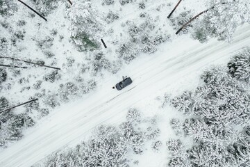 Sticker - High angle of a car driving in between the snow