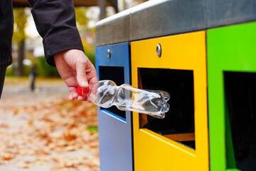 Using waste recycling bins in the public park