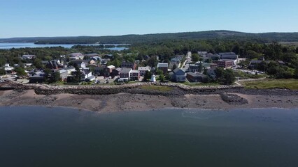 Wall Mural - Aerial movement around Nova Scotia town surrounded by buildings and trees near Annapolis River