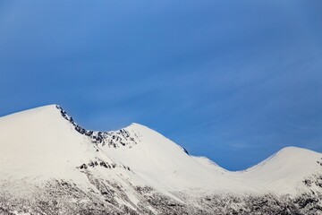 Poster - Winter mountains covered in snow against the blue sky in Tresfjorden, Vestnes, Orskogfjellet