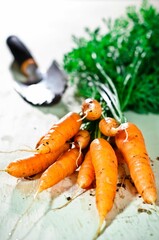 Wall Mural - Fresh carrots on a wood table