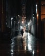 Man walking in dark alley in the ra