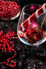 Wall Mural - red christmas decorations, glass of red wine