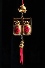 Vertical View Of Chinese Lucky Golden Trinket Set Over The Black Background