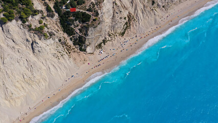 Aerial drone photo of famous paradise beach of Egremni white steep rocky hills overlooking deep turquoise Ionian sea, Lefkada island