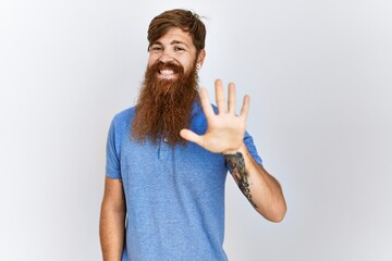 Sticker - Caucasian man with long bear standing over isolated background showing and pointing up with fingers number five while smiling confident and happy.