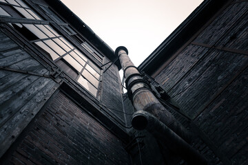 Vault of two historic buildings with a chimney in the center