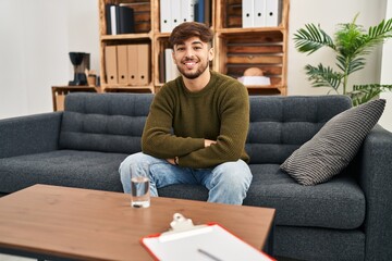 Sticker - Arab man with beard working on depression at therapy office happy face smiling with crossed arms looking at the camera. positive person.