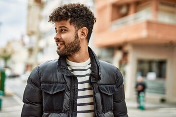 Sticker - Young arab man smiling outdoor at the town