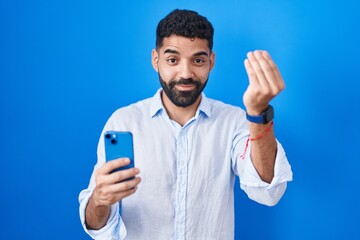 Poster - Hispanic man with beard using smartphone typing message doing italian gesture with hand and fingers confident expression