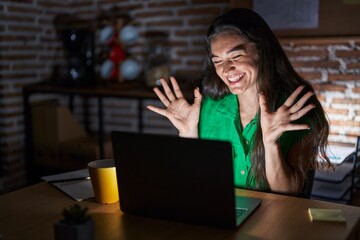 Sticker - Young teenager girl working at the office at night celebrating mad and crazy for success with arms raised and closed eyes screaming excited. winner concept