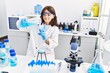 © Krakenimages.com - Young hispanic girl working at laboratory