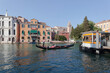 Venezia. Canal Grande con gondoliere e stazione del vaporetto