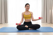 © chachamp - Asia sport woman holding dumbbell in living room at home