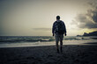 © avtk - one men walking on the beach