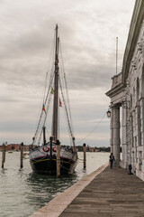 Wall Mural - old boat docked along the grand canal in Venice, Italy