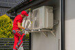 © Tomasz Zajda - HVAC Worker Performing Heat Pump and Air Condition Units Seasonal Maintenance