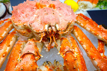 Raw Red Crab Close-up. Crab Meat In Fish Store. Sale Of Crustaceans With Tentacles. Delicious Crab On Pieces Of Ice. Appetizing Seafood. Crustacean Animal At Farmers Market. Showcase Ocean Food Store